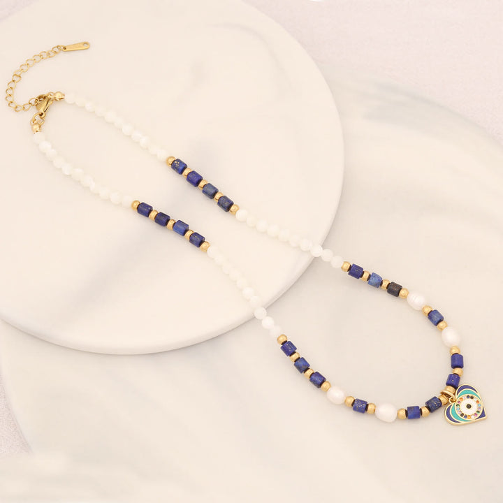Collar con colgante de ojo malvado con piedra de cristal y perla natural de Olivenorma