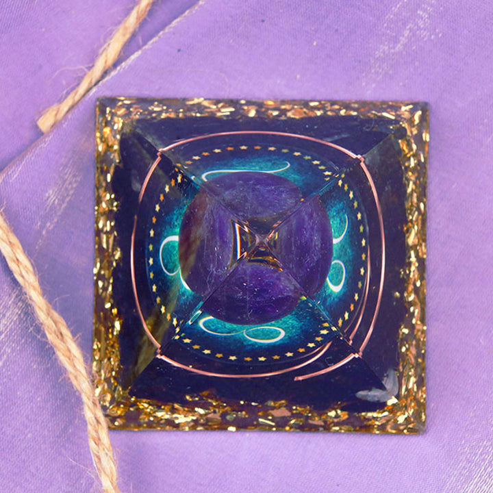 Pirámide de orgón del zodiaco Leo con esfera de amatista y obsidiana de Olivenorma 