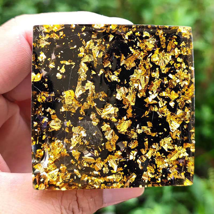 Esfera de cristal de amatista de Olivenorma con pirámide de orgón de obsidiana 