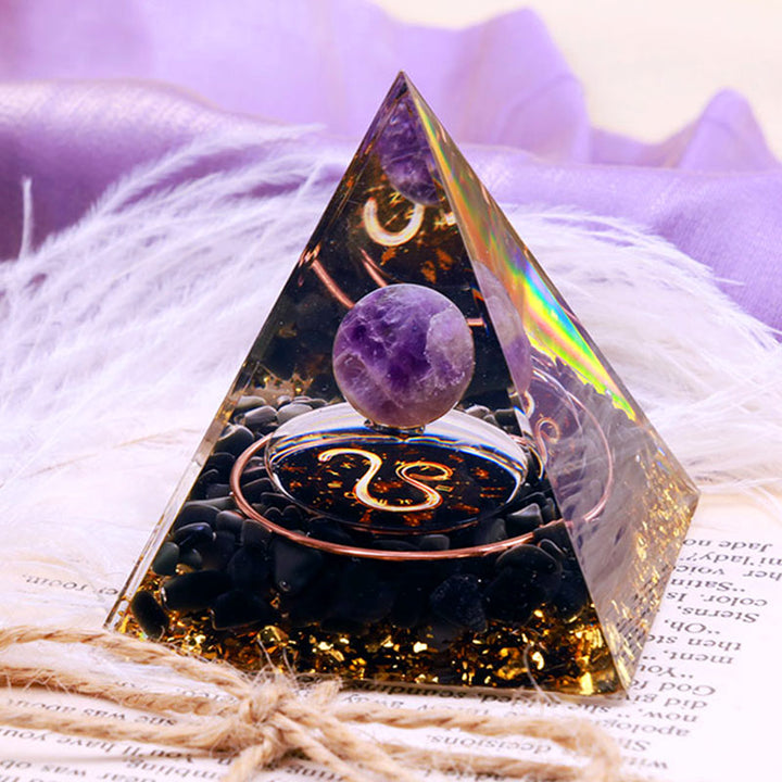 Pirámide de orgón del zodiaco Leo con esfera de amatista y obsidiana de Olivenorma 