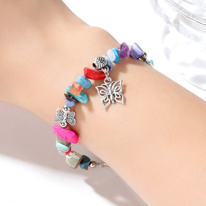 Pulsera con dije de mariposa de escombros de cristal colorido de Olivenorma