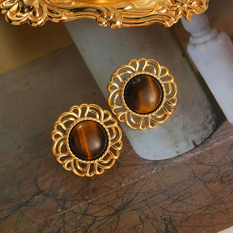Pendientes de oro con girasol y ojo de tigre de Olivenorma