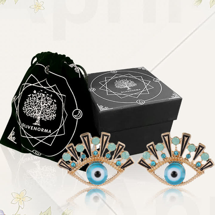 Pendientes creativos de pavo real con zafiro "Ojo de la perdición" de Olivenorma