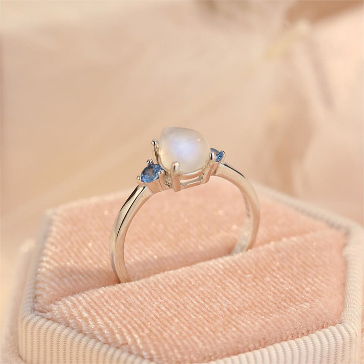 Anillo de plata de ley S925 con topacio azul y piedra lunar de Olivenorma