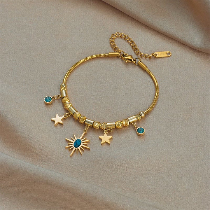 Pulsera envolvente con ojo malvado de turquesa dorada de Olivenorma
