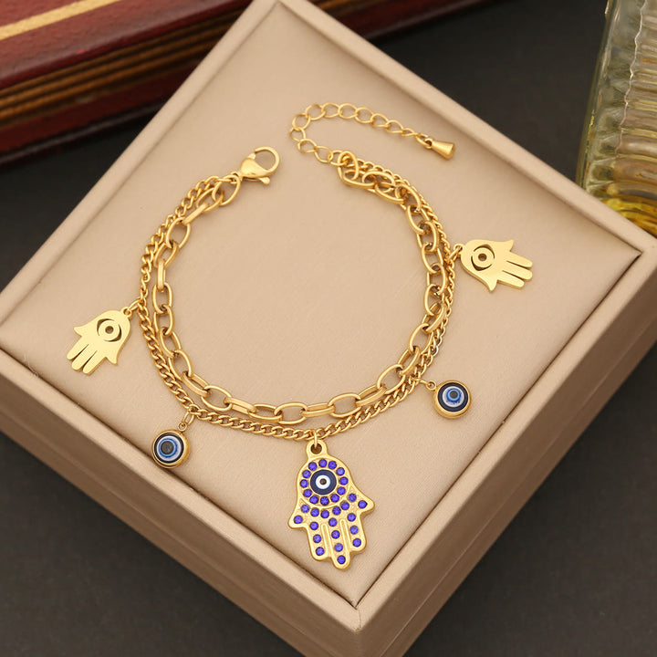 Conjunto de collar, pulsera y pendientes de resina epoxi con ojo de hamsa y mal de ojo de Olivenorma