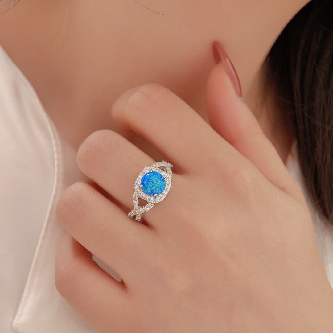 Anillo de plata de ley 925 con circonita blanca y ópalo azul de Olivenorma