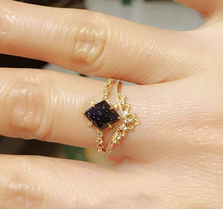 Anillo de corona de doble hilera de circonitas blancas y arenisca azul de Olivenorma