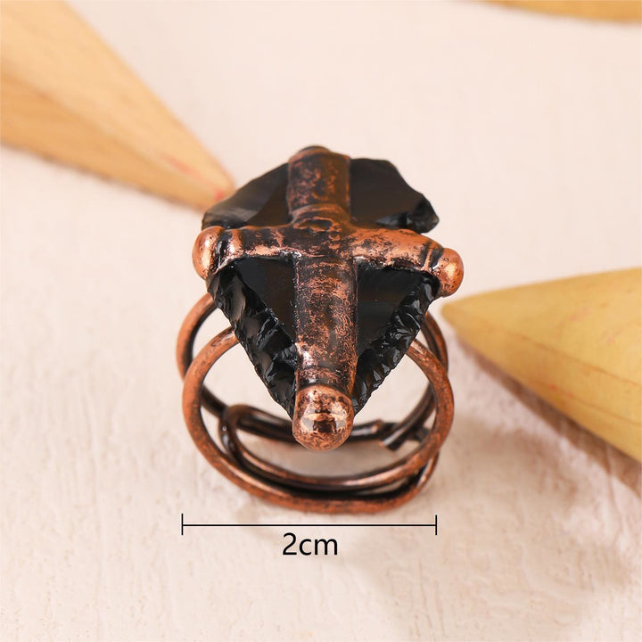 Anillo con forma de cruz y escudo de obsidiana natural de Olivenorma