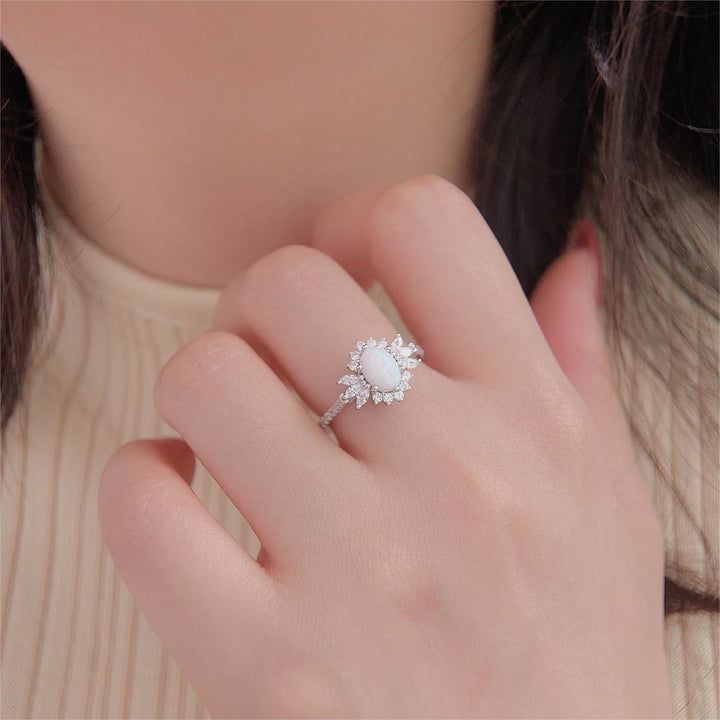 Anillo de plata 925 con diseño de girasol y ópalo azul blanco de Olivenorma 