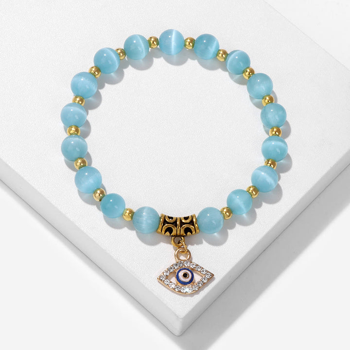 Pulsera con colgante de ojo malvado y cuentas de piedra natural de Olivenorma