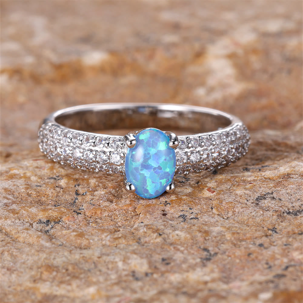 Anillo con borde de circonita y ópalo redondo "Shiny Elegance" de Olivenorma