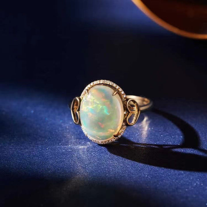 Anillo ajustable con diseño de amor en el costado y ópalo grande de Olivenorma 