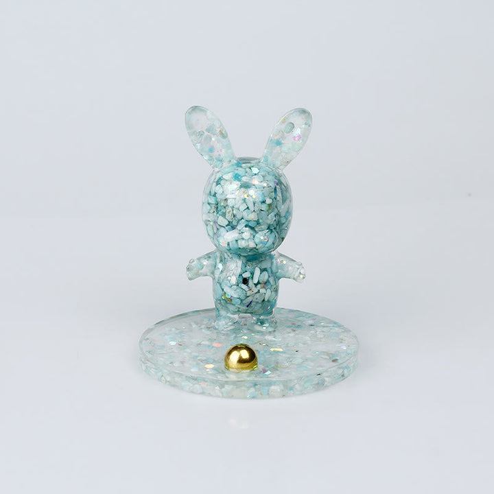 Soporte para teléfono móvil con forma de conejo de epoxi y grava de cristal natural de Olivenorma
