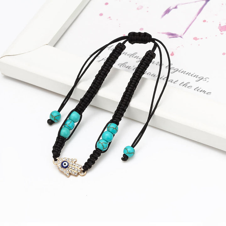 Pulsera trenzada ajustable con ojo malvado y circonita blanca y turquesa de Olivenorma 