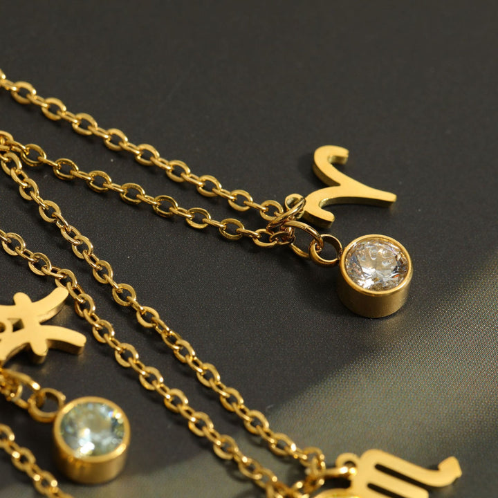 Collar de acero inoxidable con piedra natal y runa del zodíaco de Olivenorma