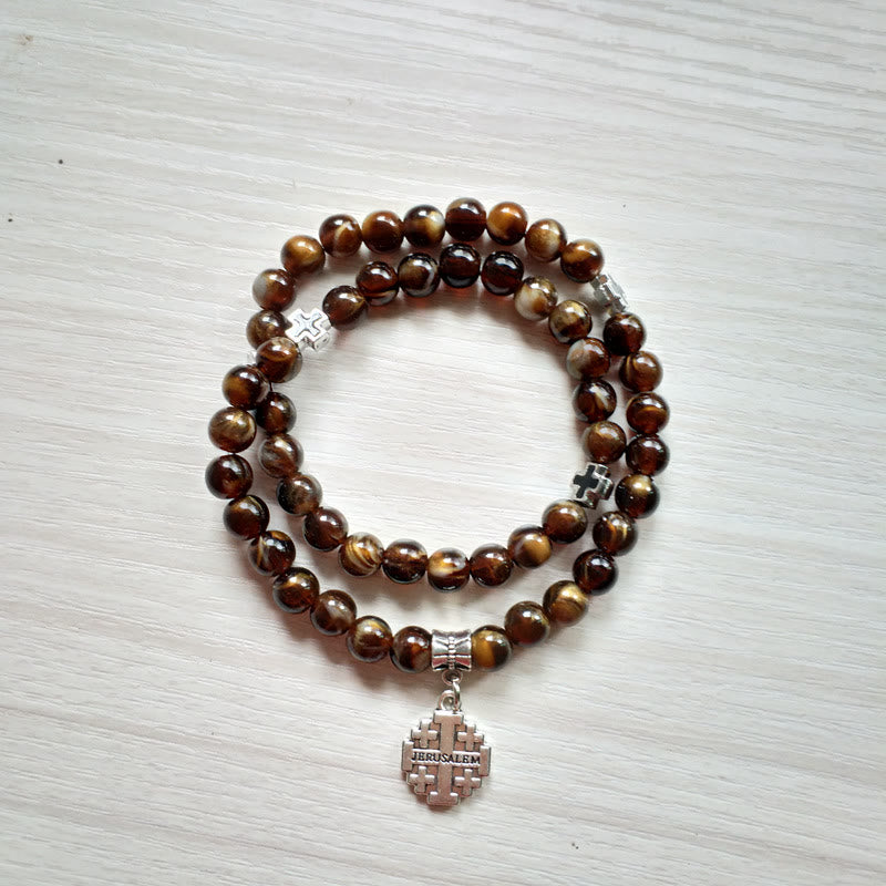 Pulsera rosario con colgante de cruz de ojo de tigre de Olivenorma