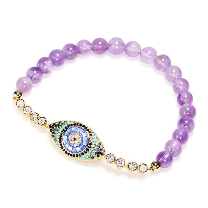 Pulsera curativa con símbolo del mal de ojo y amatista de Olivenorma 