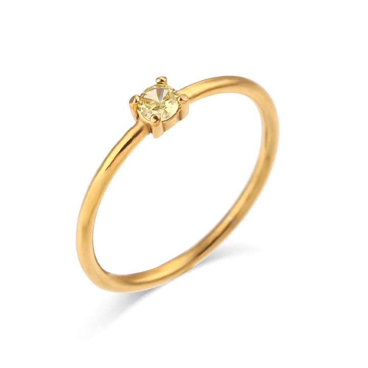 Anillo de acero inoxidable chapado en oro de 18 quilates con piedra natal simple de Olivenorma