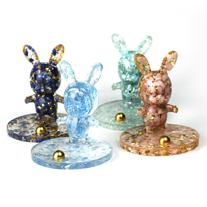 Soporte para teléfono móvil con forma de conejo de epoxi y grava de cristal natural de Olivenorma