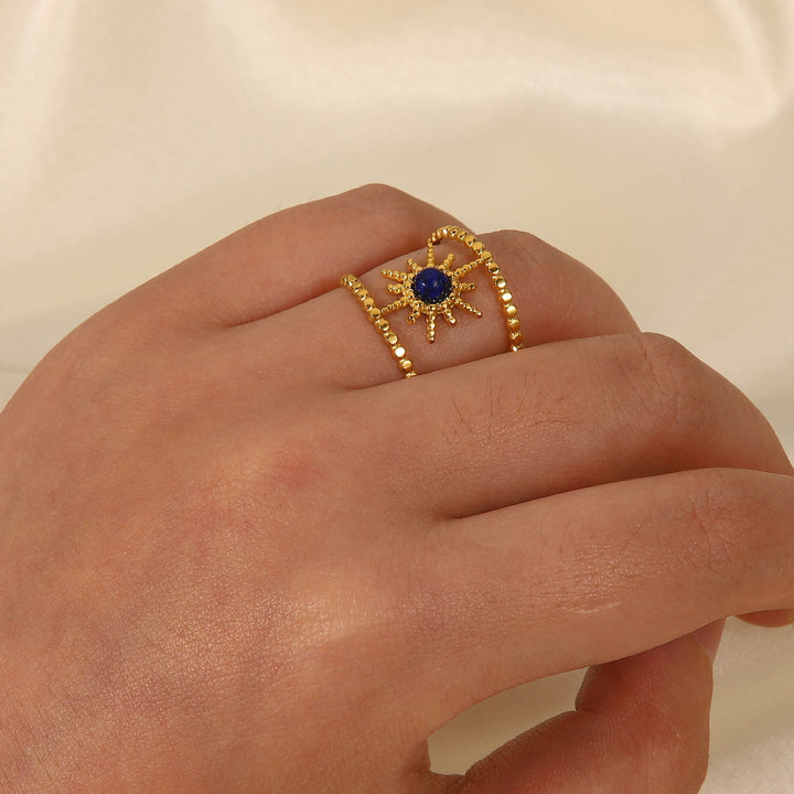 Anillo de gemas con estrella de ocho puntas y doble hilera de girasol de Olivenorma