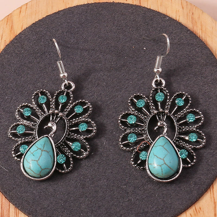 Pendientes colgantes en forma de pavo real con turmalina Paraiba y turquesa de Olivenorma