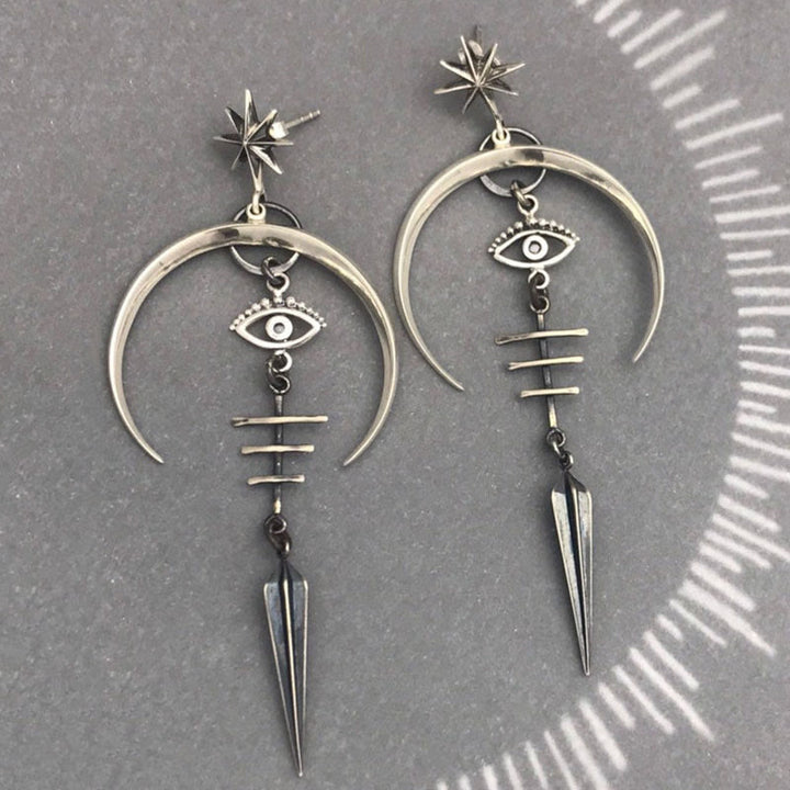 Pendientes de media luna con forma de ojo malvado de Olivenorma