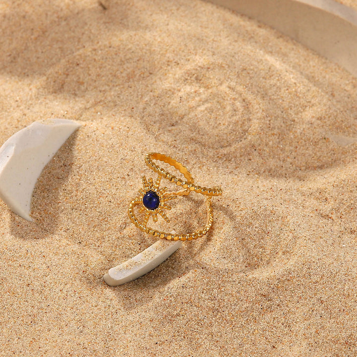 Anillo de gemas con estrella de ocho puntas y doble hilera de girasol de Olivenorma