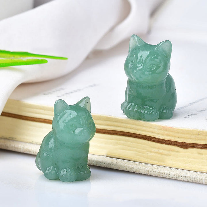 Artesanías con talladas de piedras preciosas y gatitos de cristal de Olivenorma.