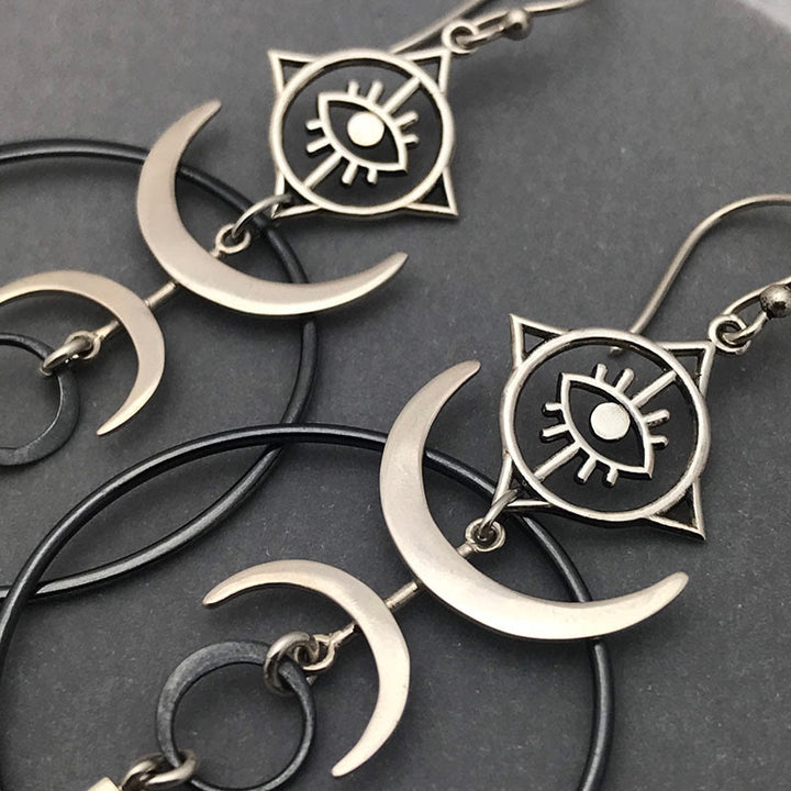 Pendientes largos con forma de media luna y forma de ojo de bruja con diseño geométrico de Olivenorma