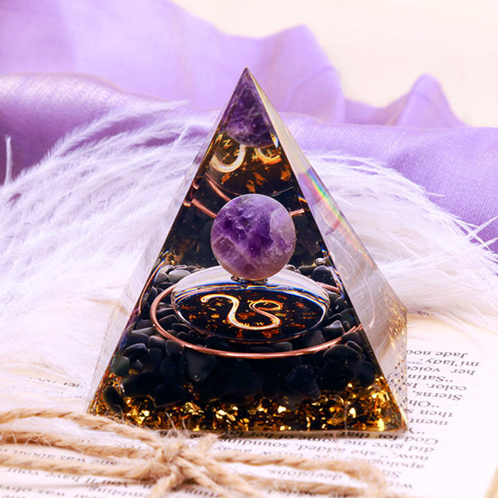 Pirámide de orgón del zodiaco Leo con esfera de amatista y obsidiana de Olivenorma 