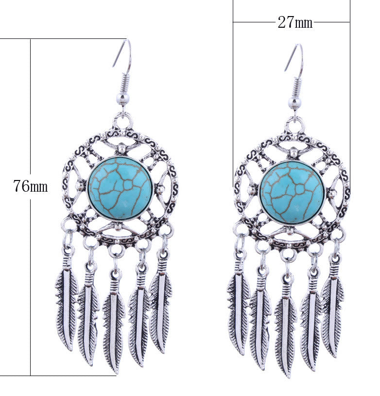Pendientes de borlas con plumas de plata y turquesa de Olivenorma