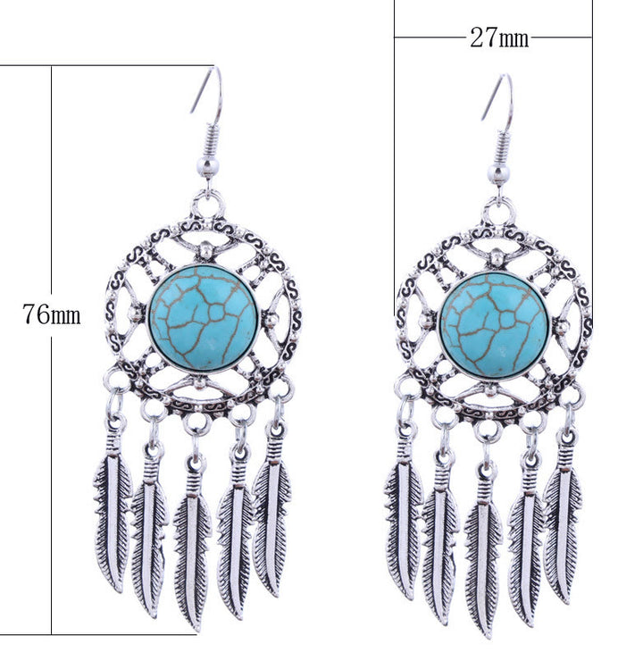 Pendientes de borlas con plumas de plata y turquesa de Olivenorma