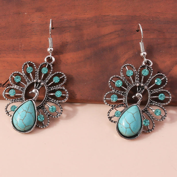 Pendientes colgantes en forma de pavo real con turmalina Paraiba y turquesa de Olivenorma