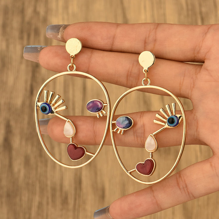 Pendientes con colgante de cara de mal de ojo de ágata roja de Olivenorma