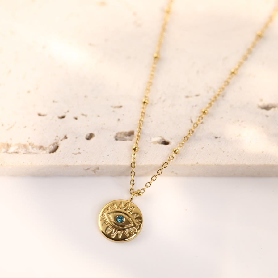 Collar de acero de titanio 316L con ojo malvado y topacio azul de Olivenorma