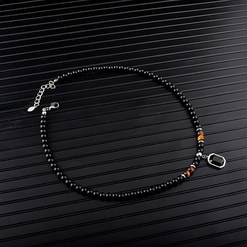 Collar de acero y titanio con cuentas de obsidiana y ojo de tigre para hombre de Olivenorma