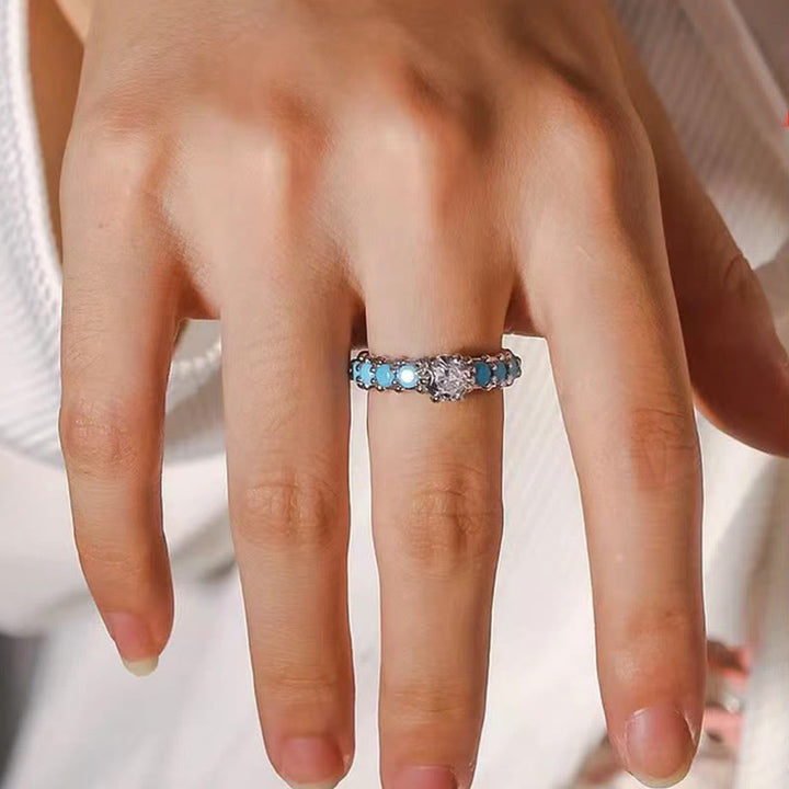 Anillo de compromiso con diamantes y circonita blanca turquesa de Olivenorma