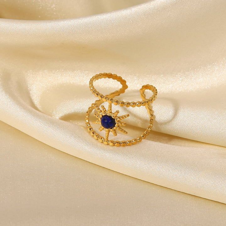 Anillo de gemas con estrella de ocho puntas y doble hilera de girasol de Olivenorma
