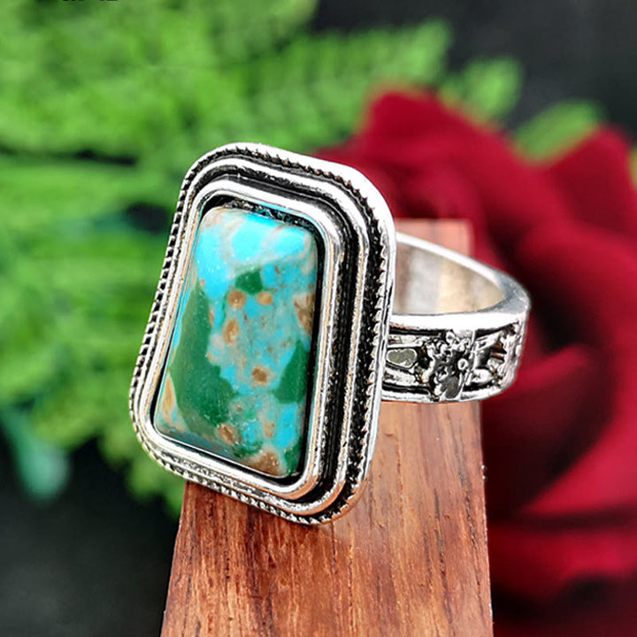 Anillo de plata con rosa en relieve bañado en piedra del emperador Olivenorma 