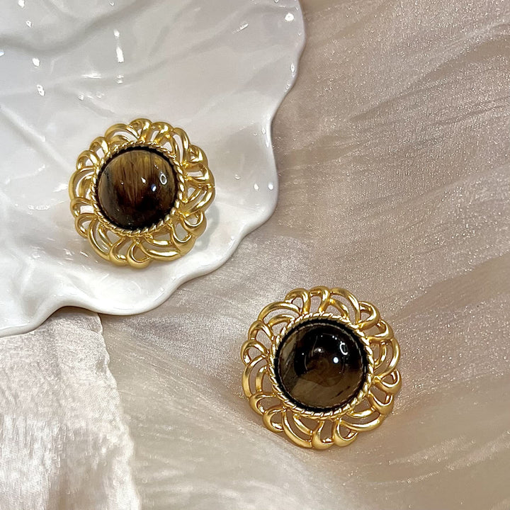 Pendientes de oro con girasol y ojo de tigre de Olivenorma