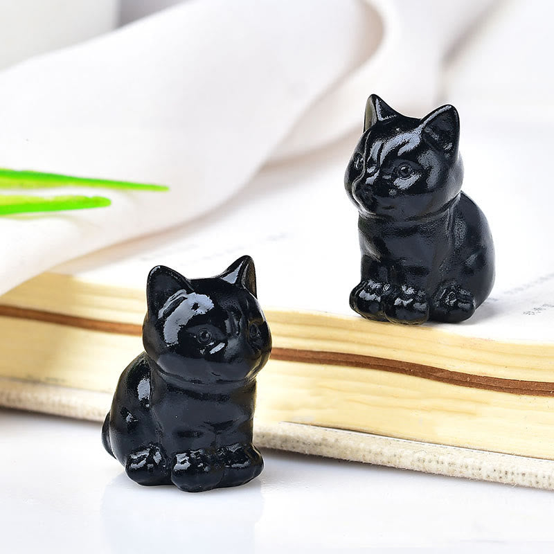 Artesanías con talladas de piedras preciosas y gatitos de cristal de Olivenorma.