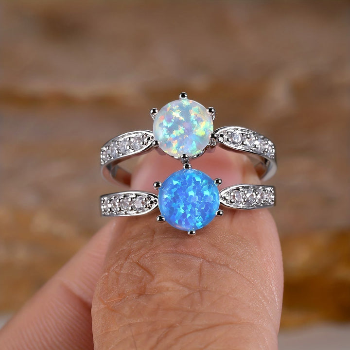 Anillo de banda con borde de ópalo redondo y seis garras de Olivenorma