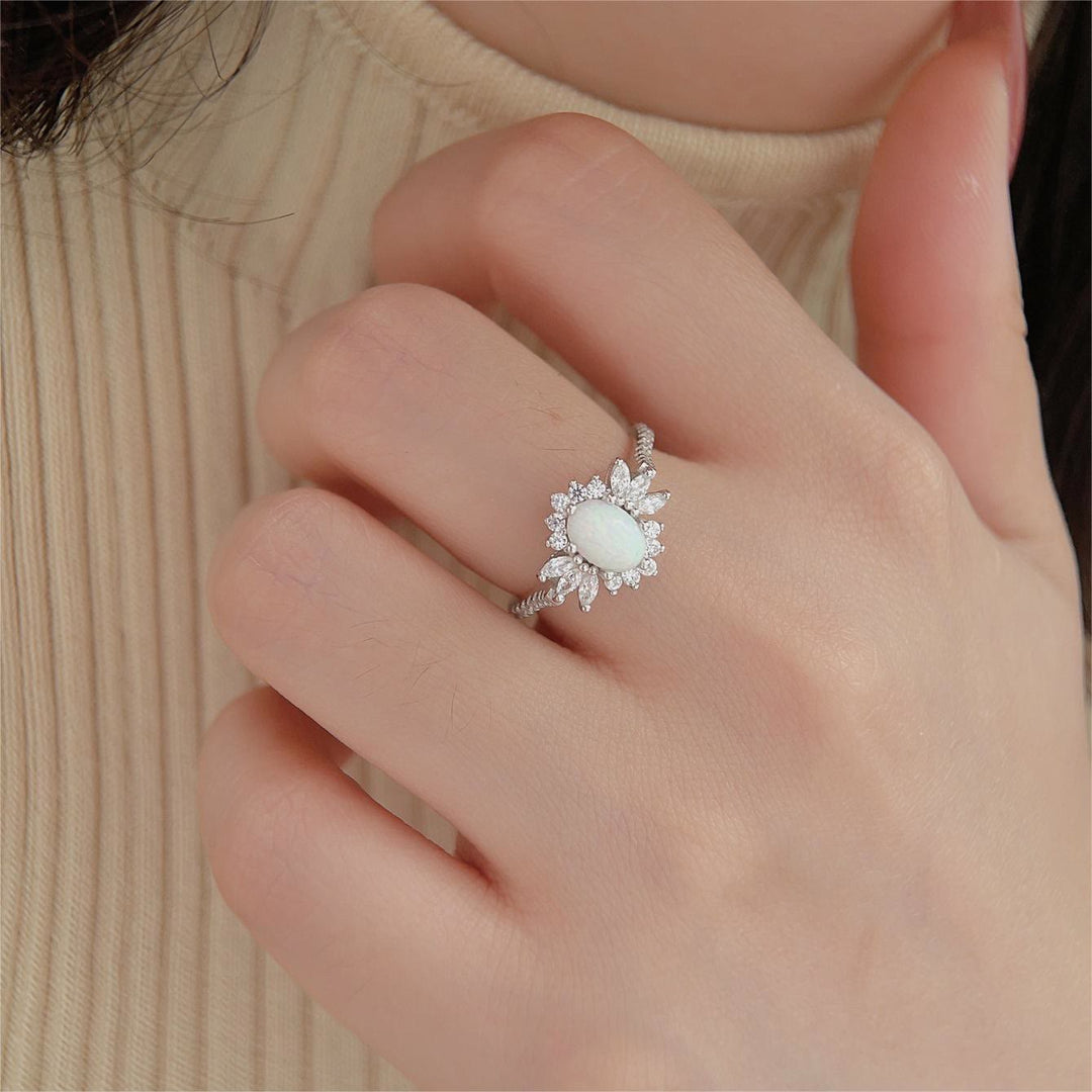 Anillo de plata 925 con diseño de girasol y ópalo azul blanco de Olivenorma 