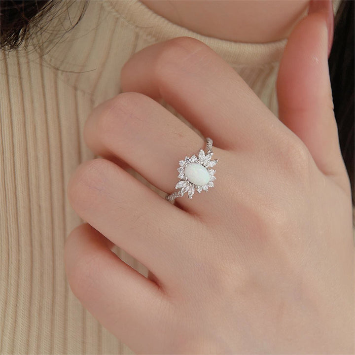 Anillo de plata 925 con diseño de girasol y ópalo azul blanco de Olivenorma 