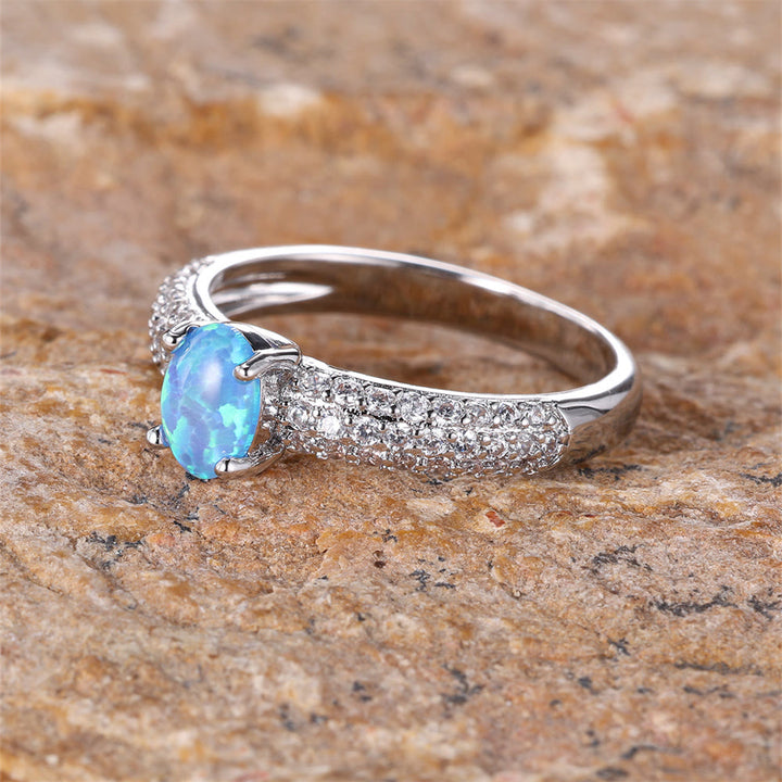 Anillo con borde de circonita y ópalo redondo "Shiny Elegance" de Olivenorma