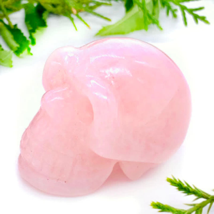 Decoración de calavera de cristal de cuarzo rosa