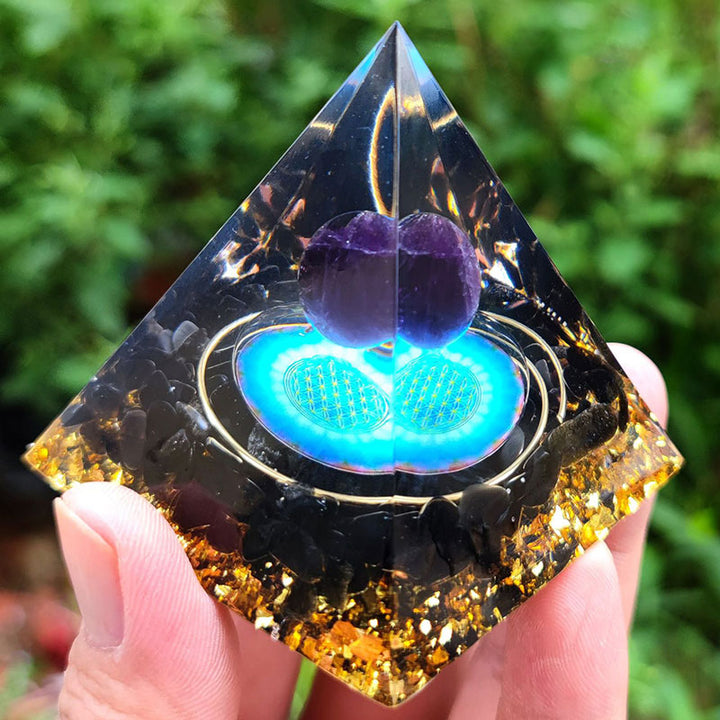 Esfera de cristal de amatista de Olivenorma con pirámide de orgón de obsidiana 