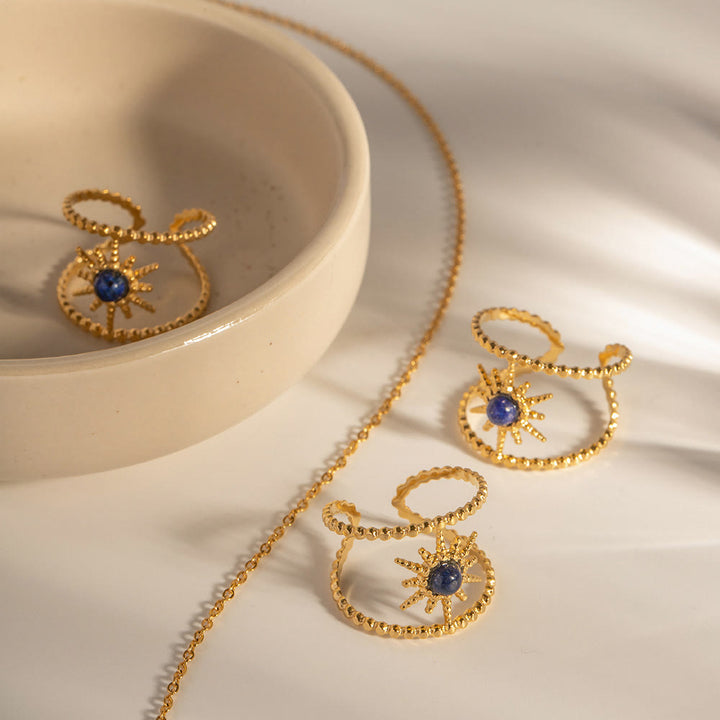 Anillo de gemas con estrella de ocho puntas y doble hilera de girasol de Olivenorma