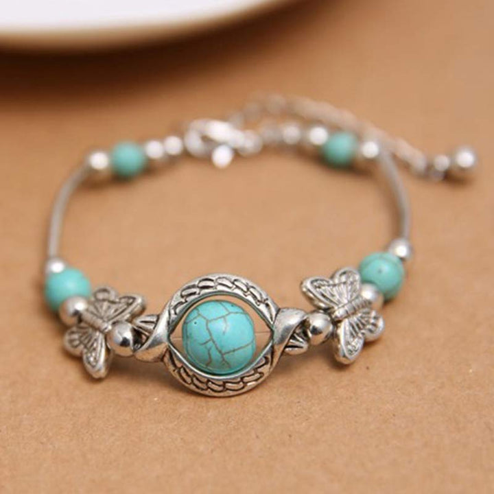 Pulsera de mariposa con esfera turquesa de Olivenorma